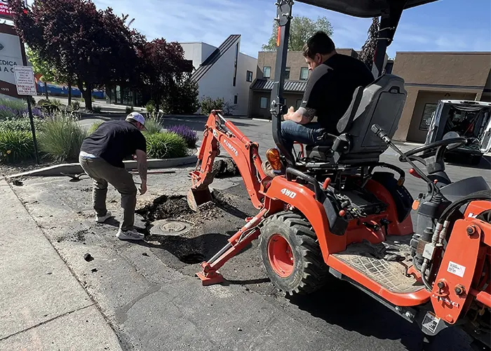 Xpress Plumbing technician working on a plumbing repair