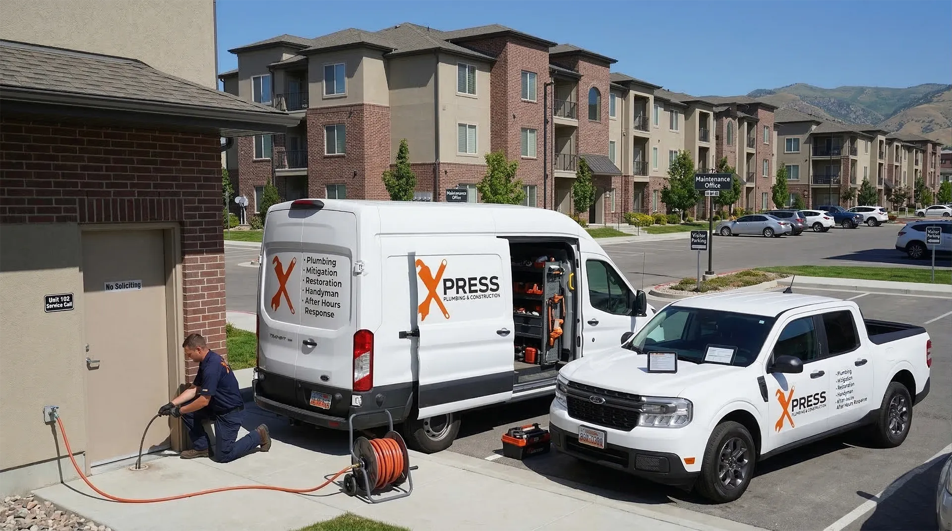 Commercial plumbing and restoration technician servicing a business property